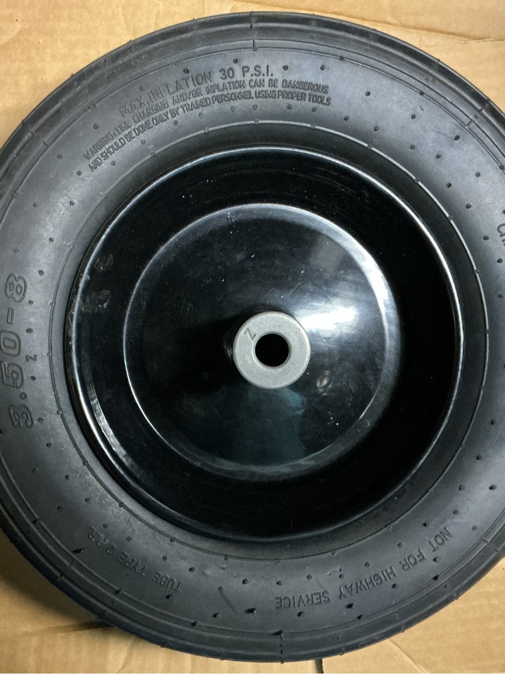 Believe this is a wheel barrel front wheel.